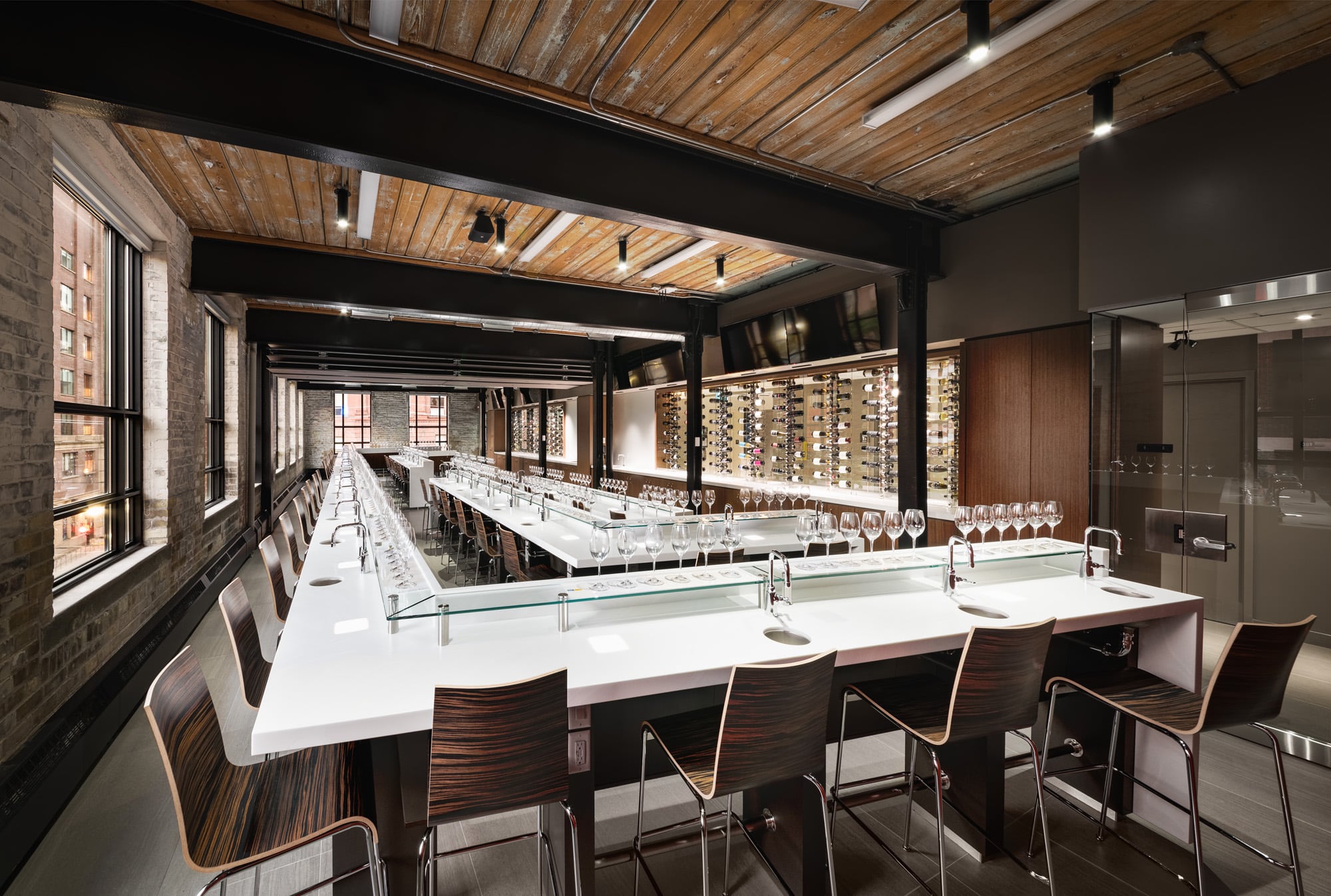 The wine tasting lab, featuring clean white countertops to highlight the wine colours, Image by Photolux.